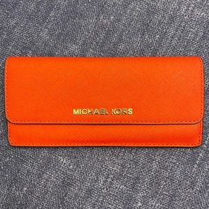 Michael Kors red slim wallet hold 8 credit cards with coin zipper.